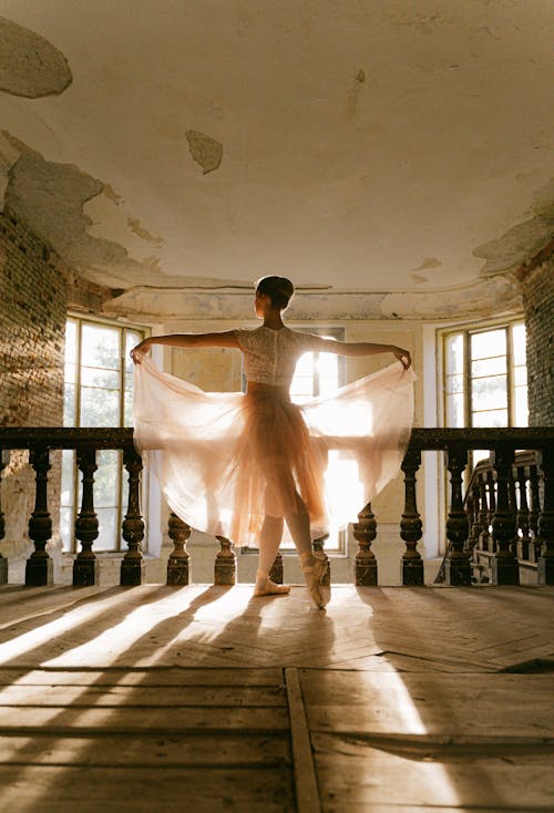 Back View Shot of Ballerina Dancing Near the Concrete Railing