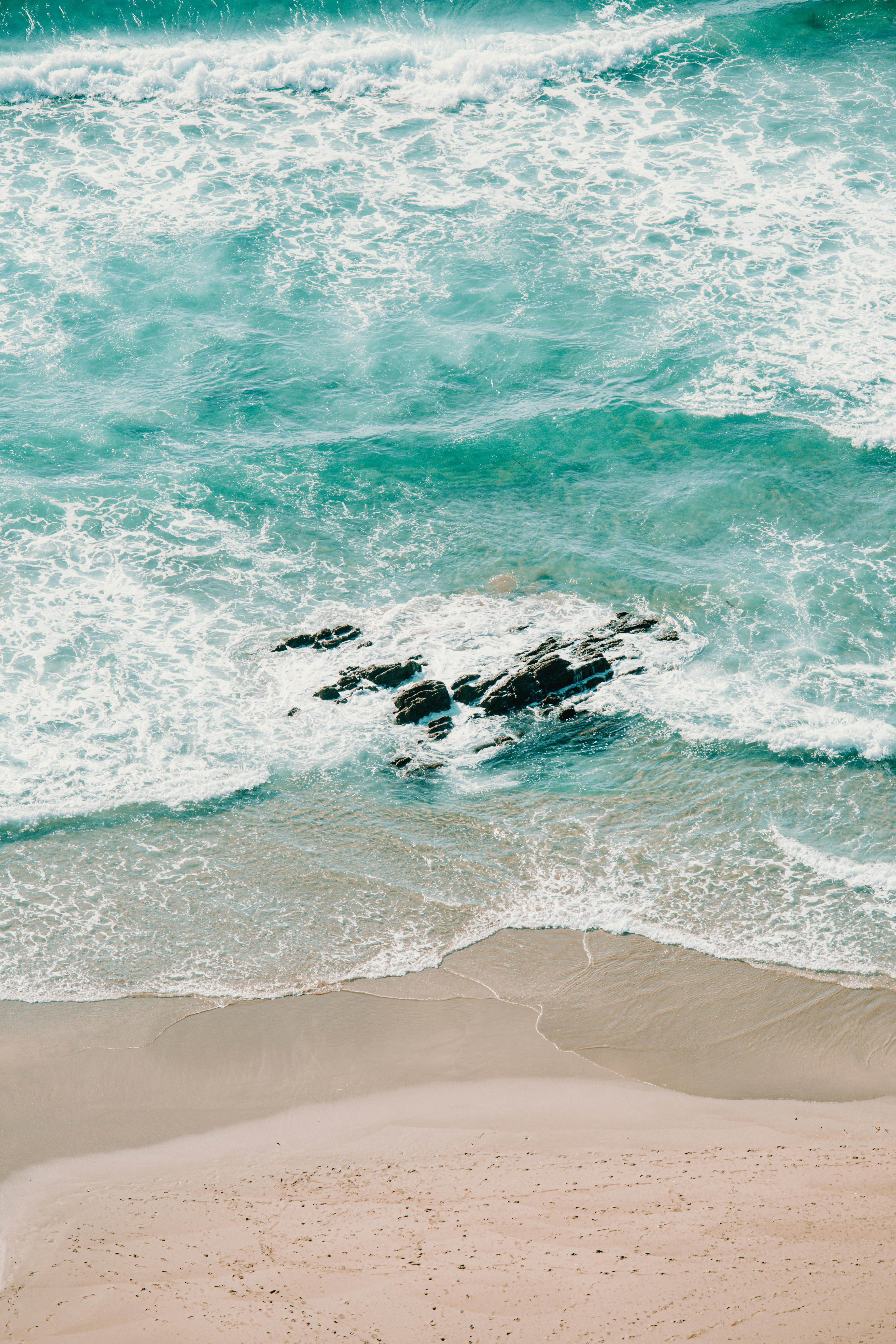 sea waving near sandy shore