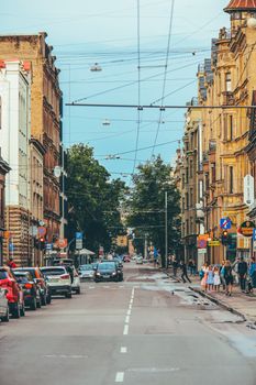 Street scene in Riga, Latvia showcasing historic architecture and urban life.