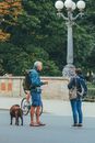 Travelers with Backpacks Standing on City Street