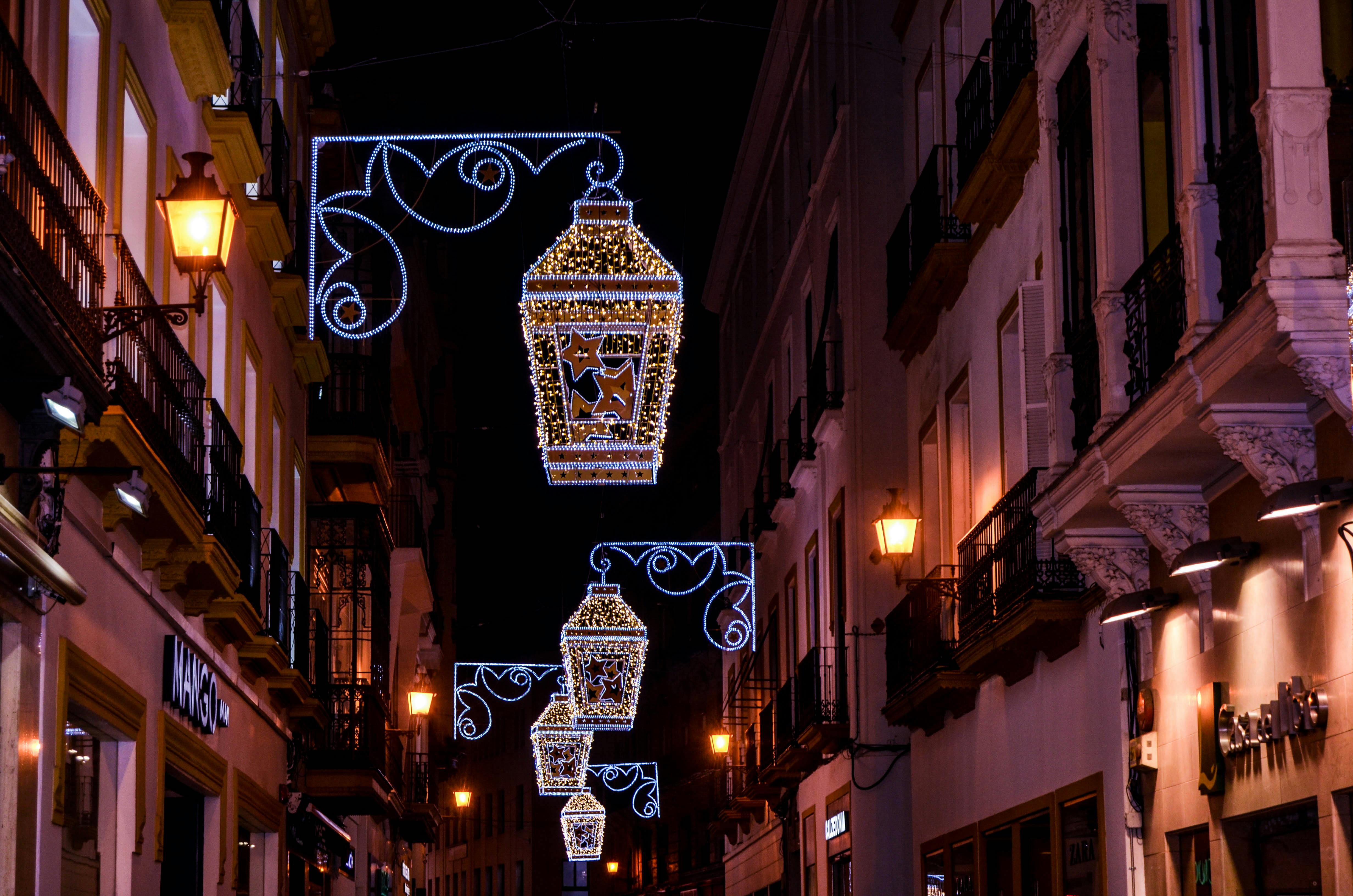 Colorful Street Lights Near Commercial Establishment · Free Stock Photo