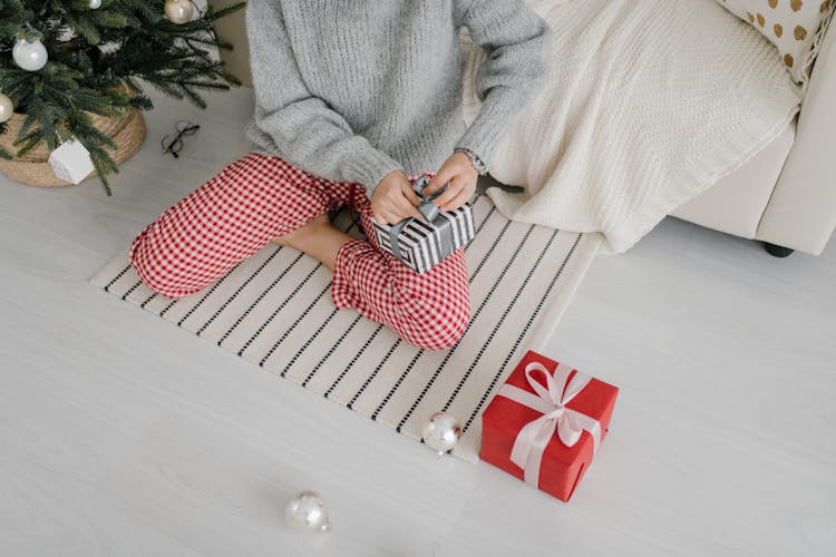 Person Wrapping A Gift