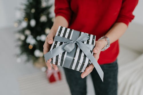 Free Close-Up Shot of a Person Holding a Gift Box Stock Photo