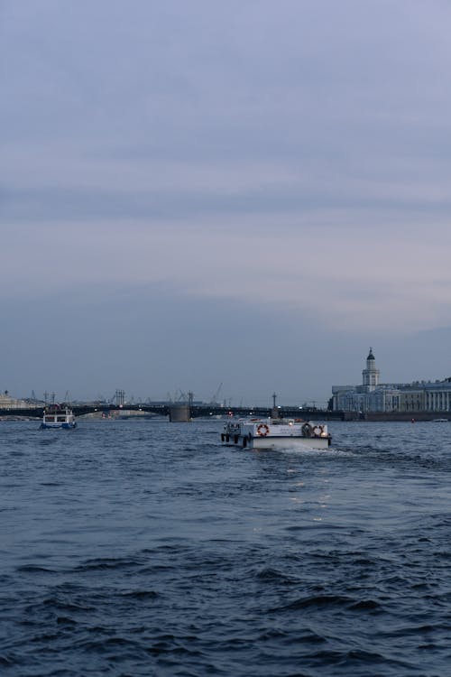 Ferries on River in City