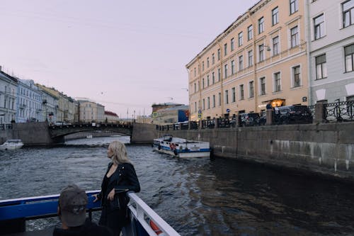 People on Boats in City