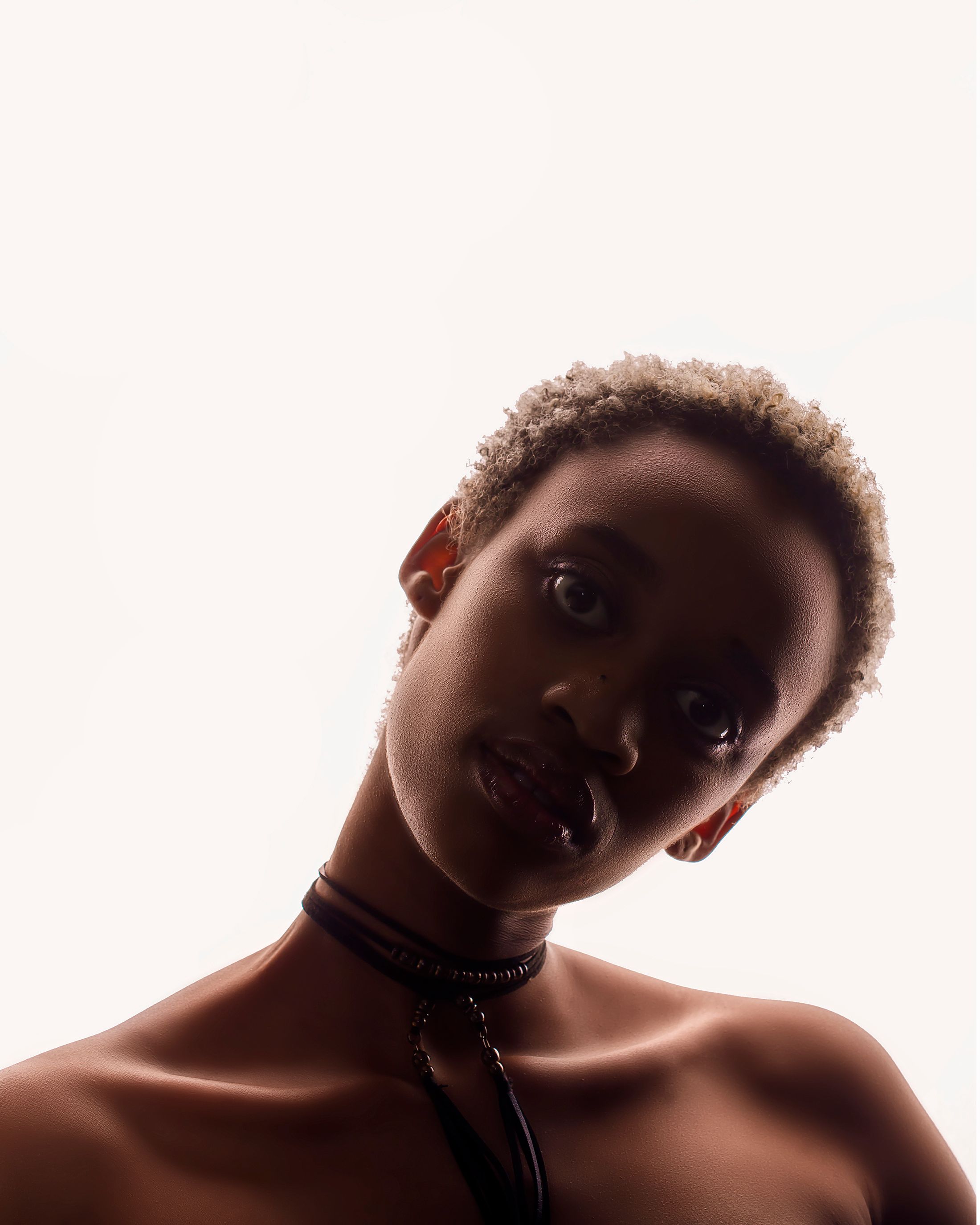 Calm young black woman with necklace · Free Stock Photo