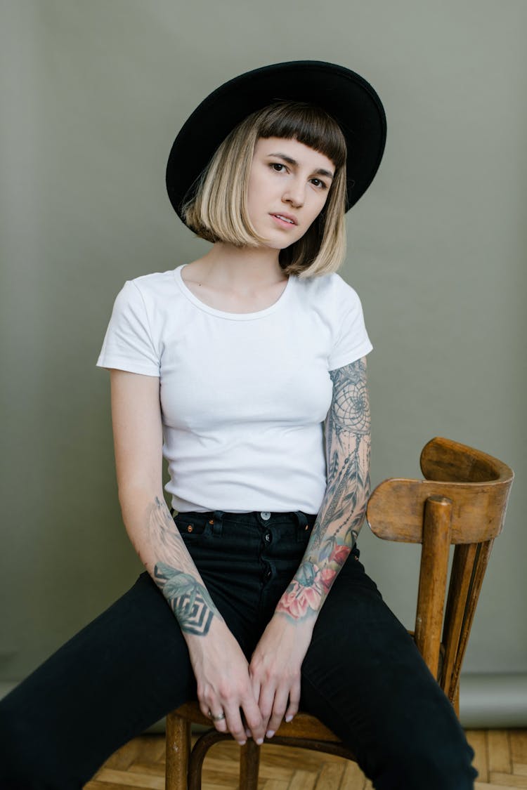 Stylish Woman Resting On Wooden Chair