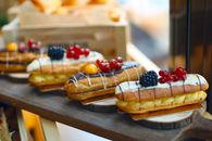 Brown Bread With Red and White Toppings on Brown Wooden Tray