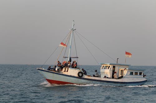 People Riding on Boat