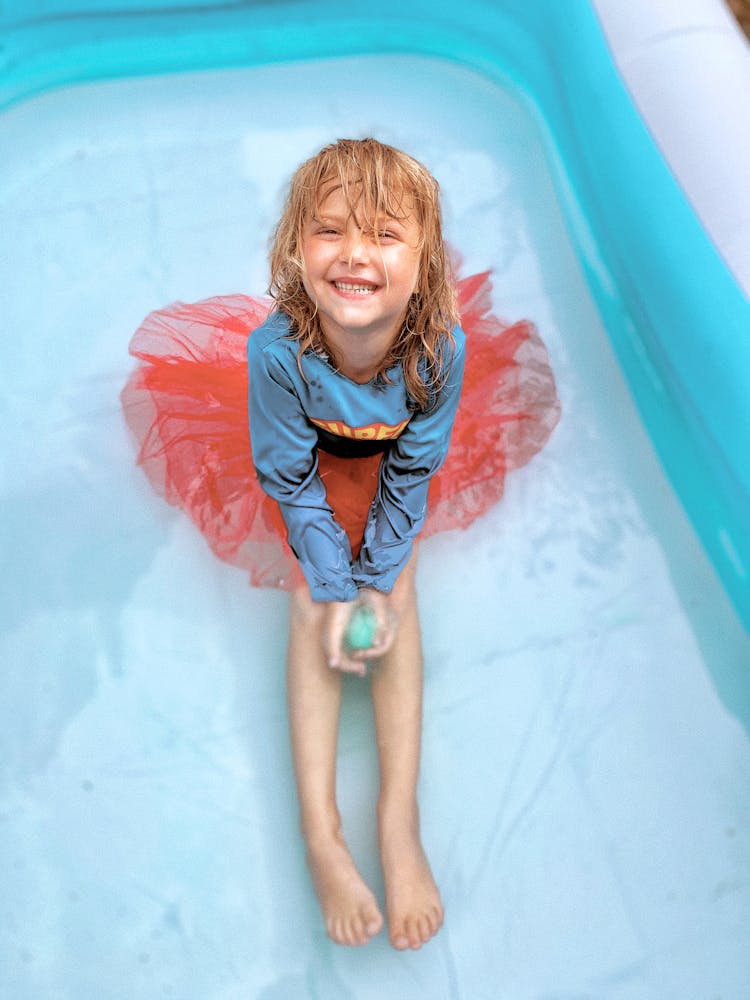 Girl In Costume In Swimming Pool