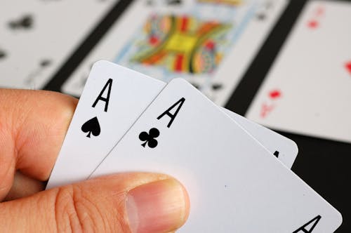 a Hand Holding Cards