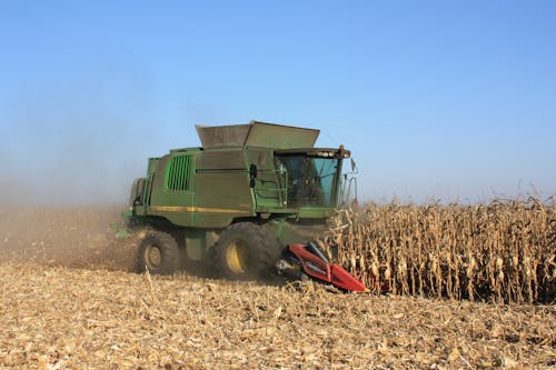 Free Combine Harvesting on a Cropland Stock Photo