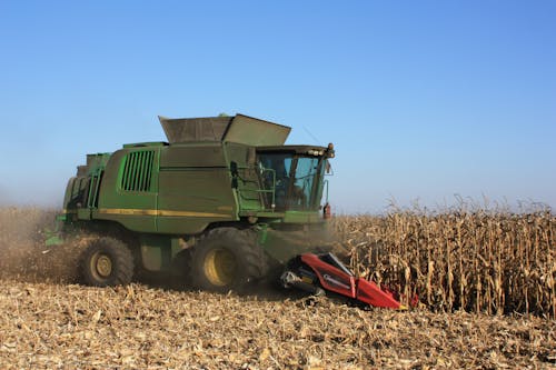 Tractor Working in Field Harvesting Crop