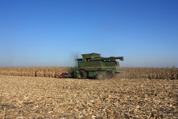 Combine Harvester On Field