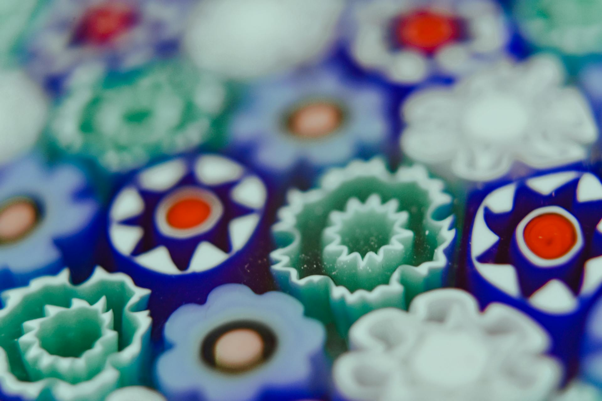 Background of closeup of colorful elements arranged in order created in technique millefiori