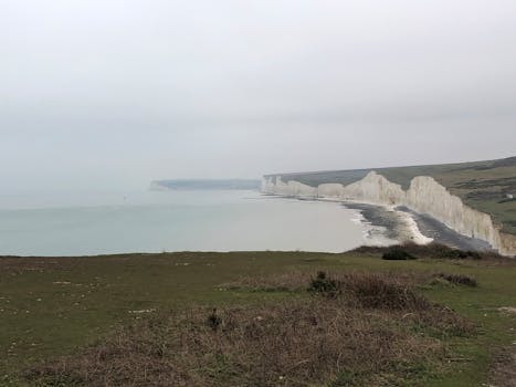 Misty view of the iconic Seven Sisters cliffs along the English coastline.