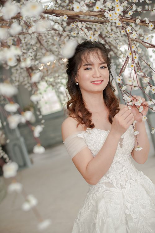 A Beautiful Woman Wearing White Elegant Wedding Gown while Smiling at the Camera Free Stock Photo A Beautiful Woman Wearing White Elegant Wedding Gown while Smiling at the Camera Free Stock Photo