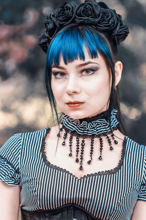 Free Portrait of a woman in Gothic steampunk costume with a floral crown Stock Photo
