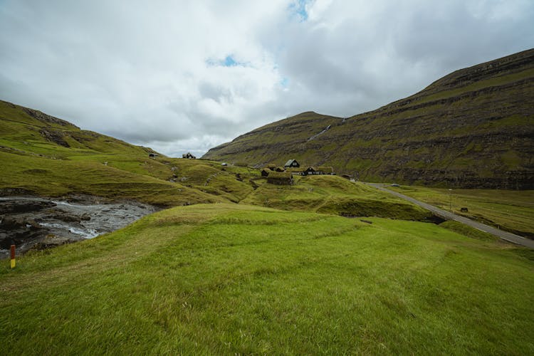 Houses On Green Mountain Lowland In Scotland