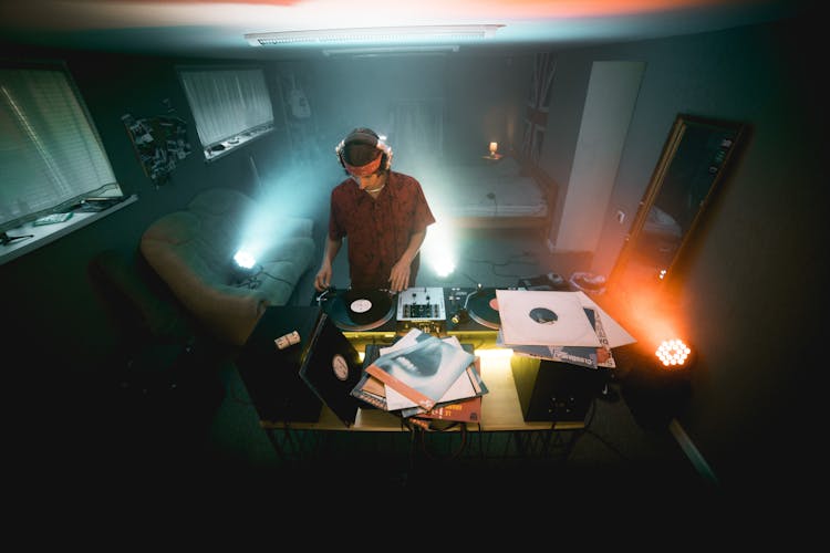 A DJ Playing In An Apartment