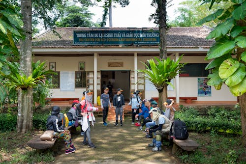 Group of travelers preparing for trekking in tropical woods