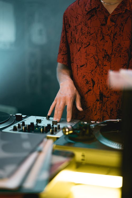 A Person Playing Dj Controller