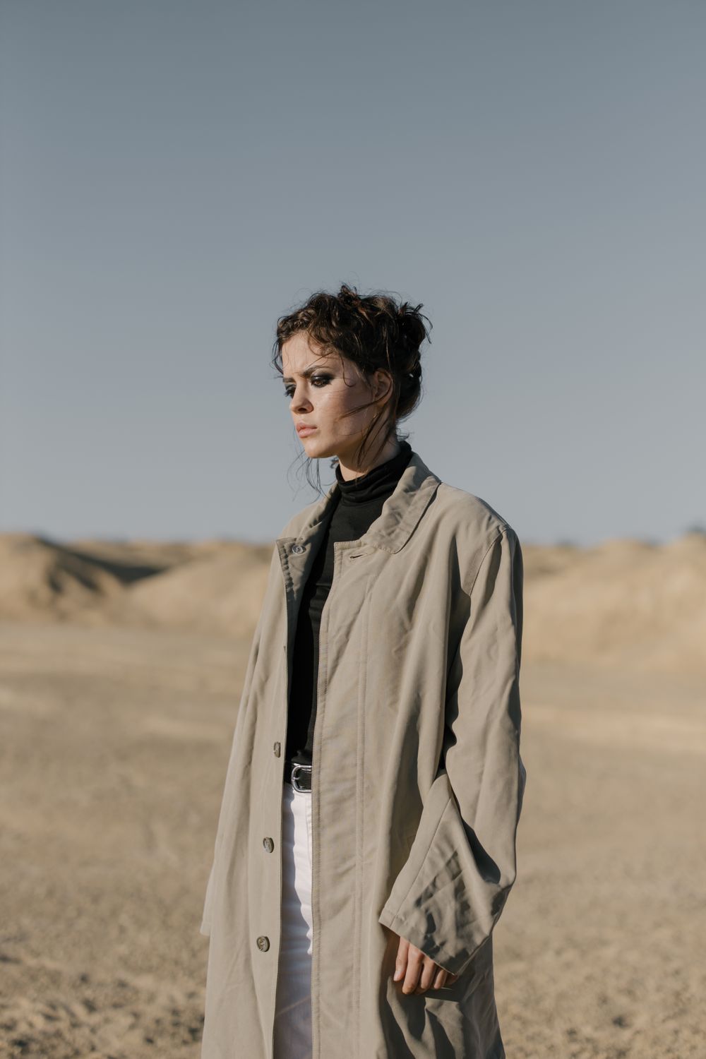 Woman in Brown Coat Standing on Brown Field · Free Stock Photo