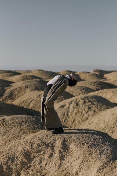 Foto profissional grátis de alívio, ao ar livre, areia
