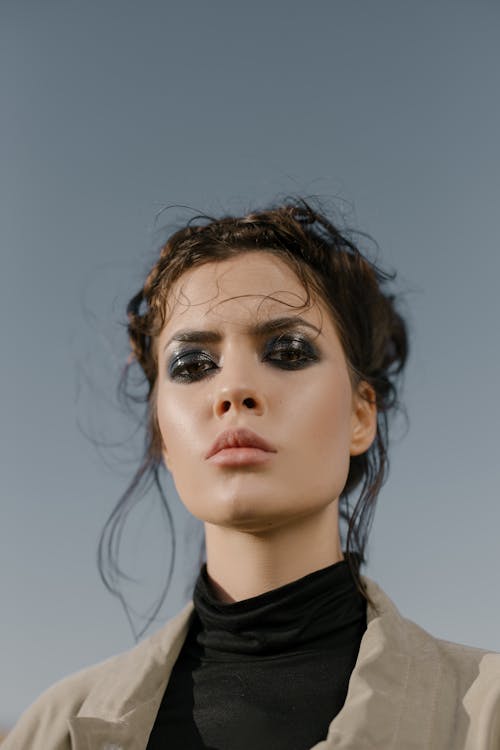 Free Low Angle Photo of Woman with Dark Eyeshadow Stock Photo