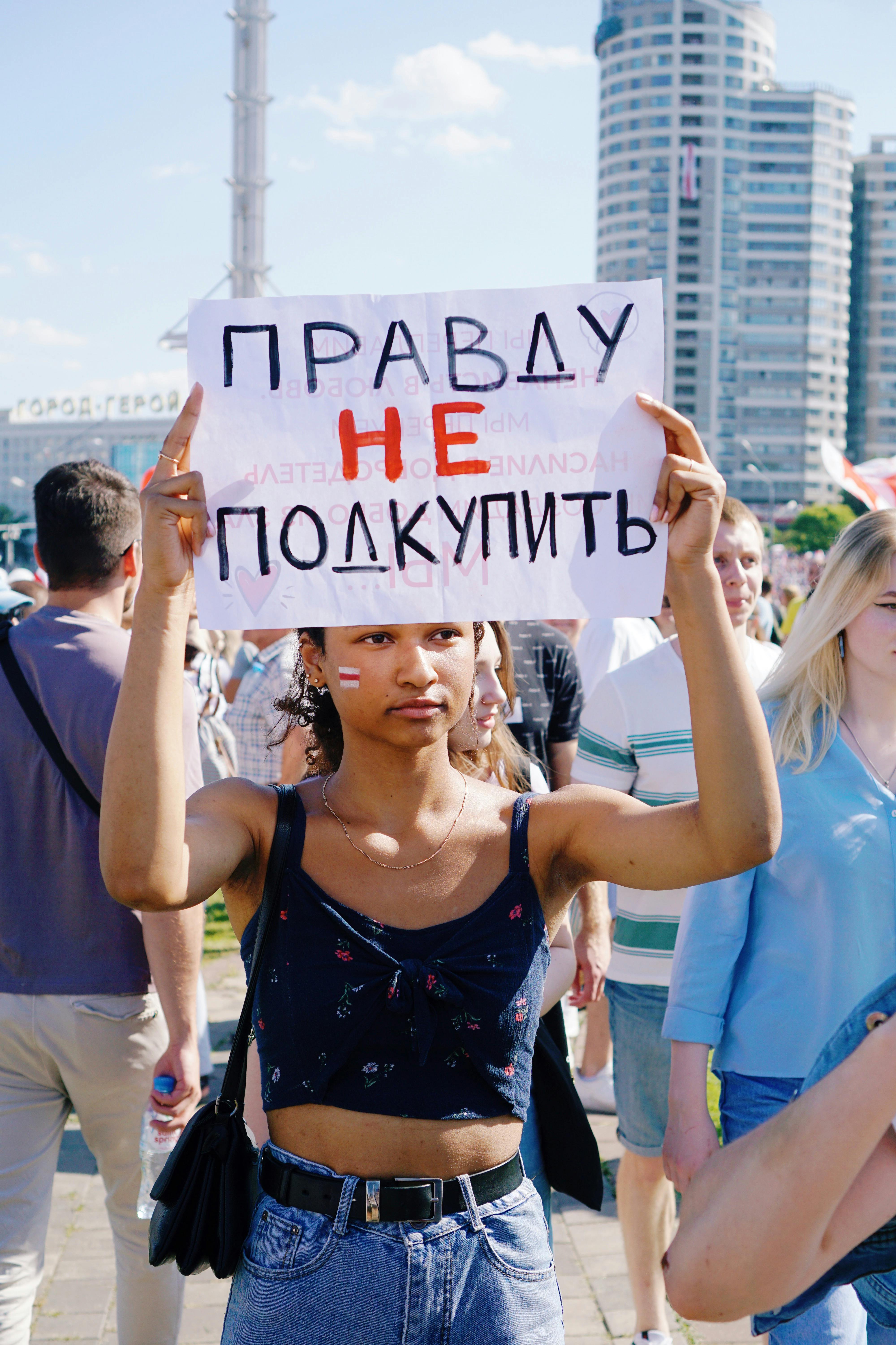 female protester holding a sign