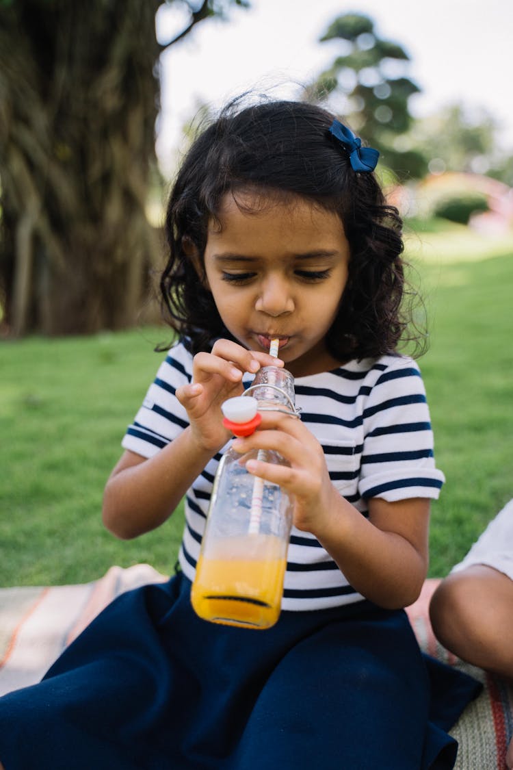 Cute Girl Drinking Orange Juice