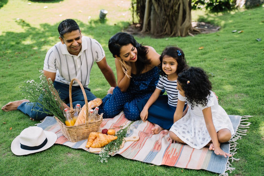 Family enjoying a breakfast picnic