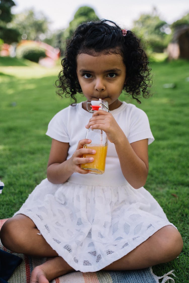 Cute Girl Drinking Orange Juice