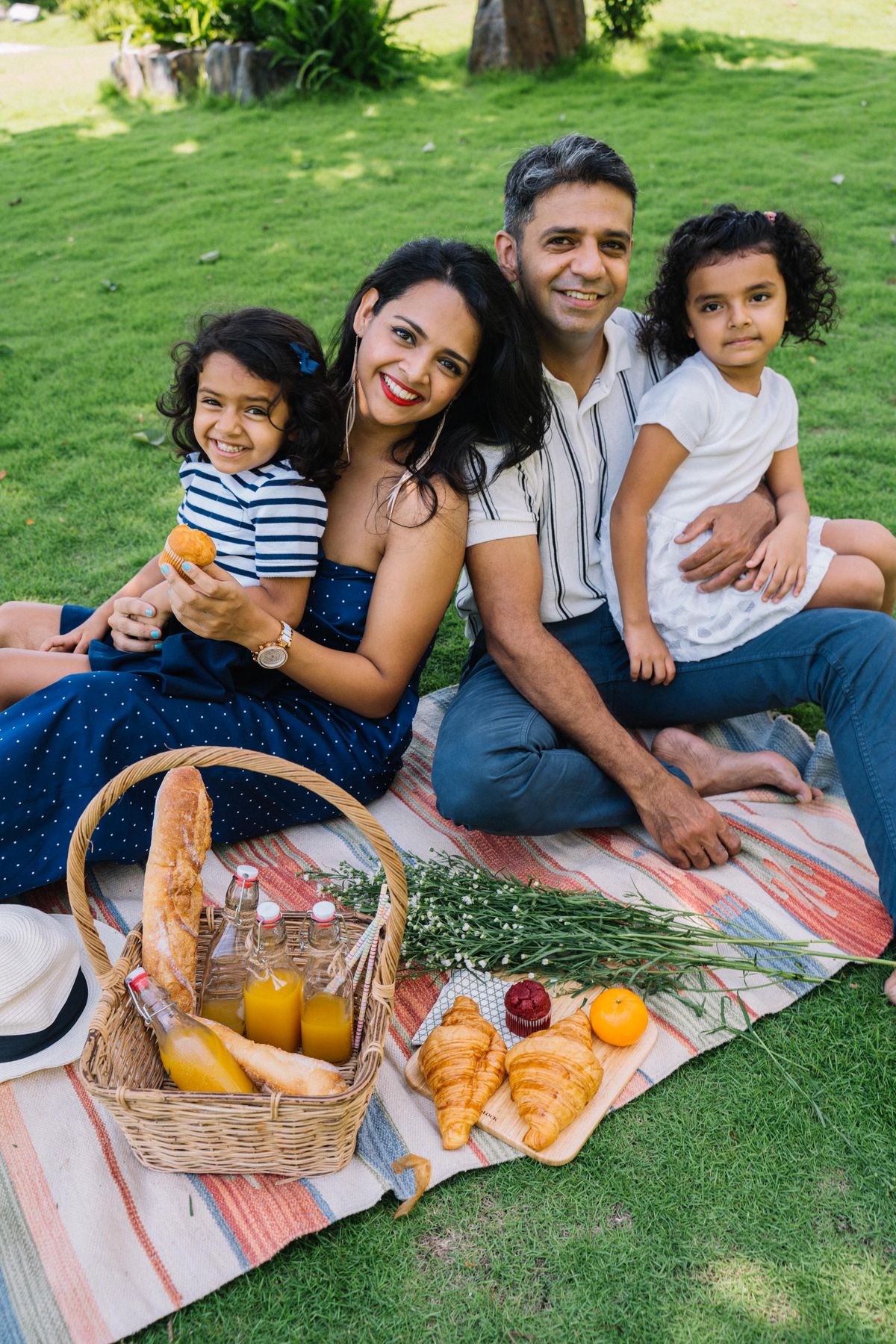 Family enjoying a picnic together outdoors