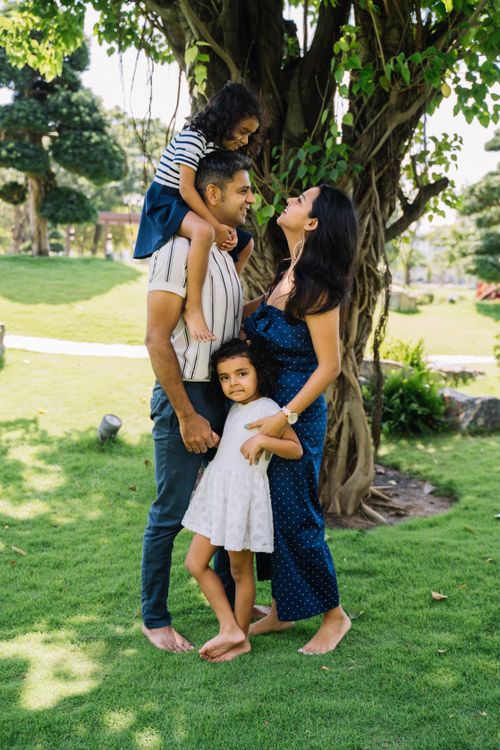 Free A joyful family enjoying quality time together outdoors in a sunny park. Stock Photo