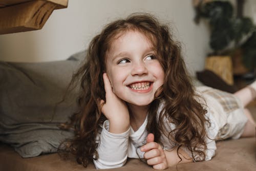 Close-up Photo of Happy Cute Girl