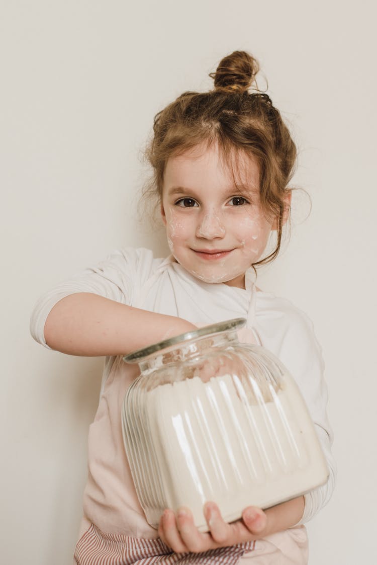 Pretty Girl Holding A Jar