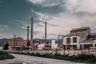White and Brown Concrete Building Under White Clouds