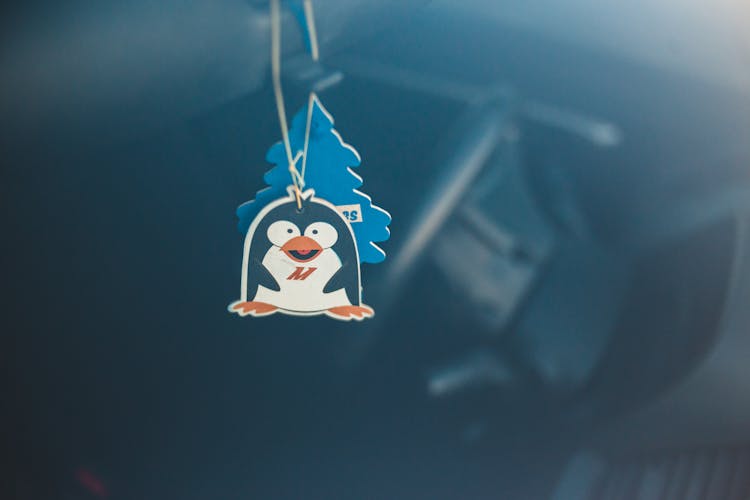 Decorative Paper Pendant In Form Of Penguin In Vehicle