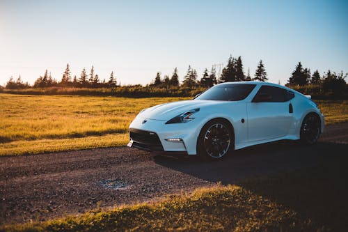 Luxury car riding on pathway