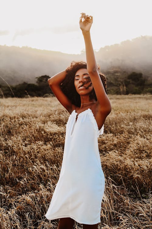 Black woman standing in grassy field