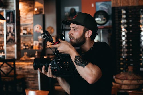 A Bearded Man Shooting a Film