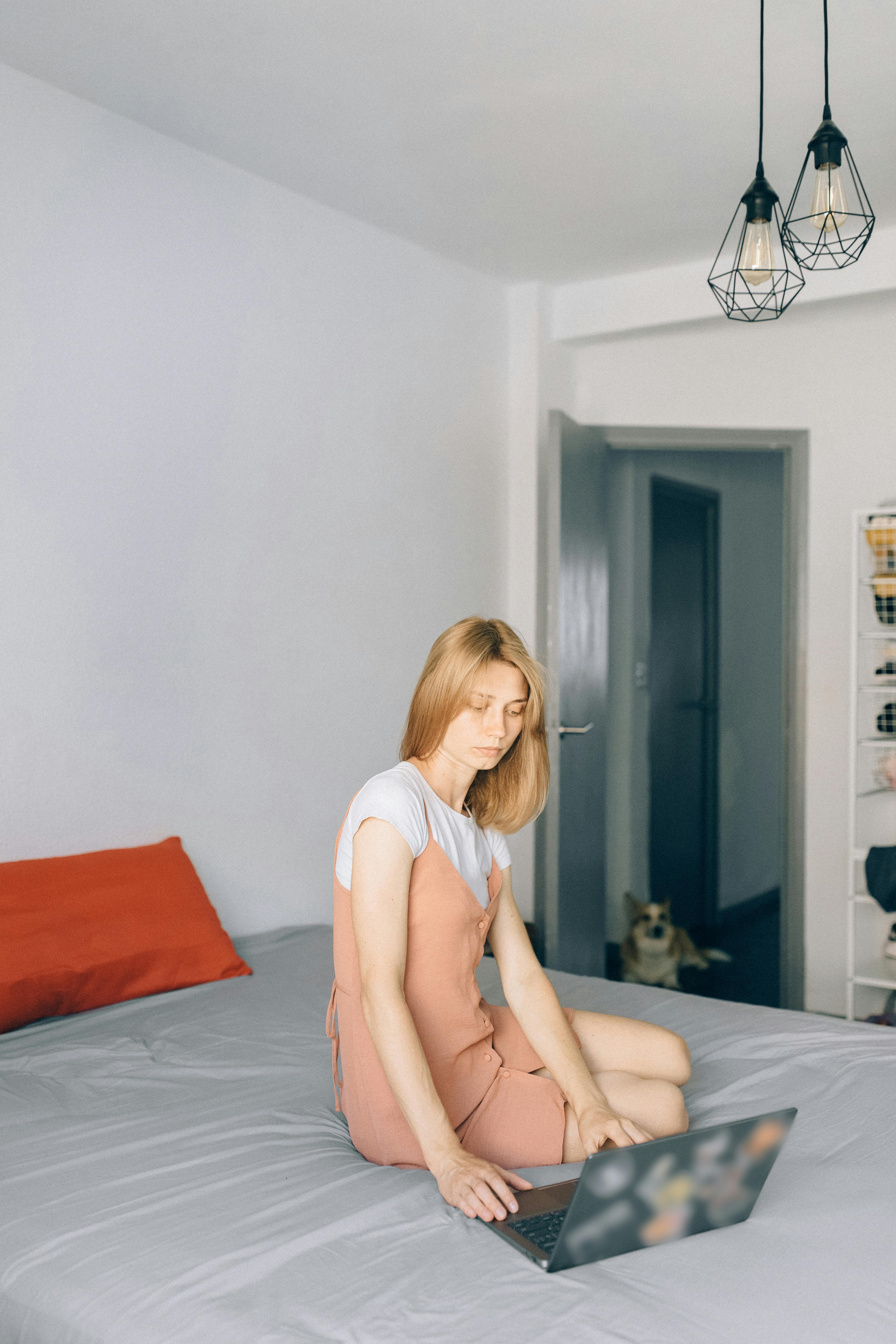 a woman working inside her bedroom