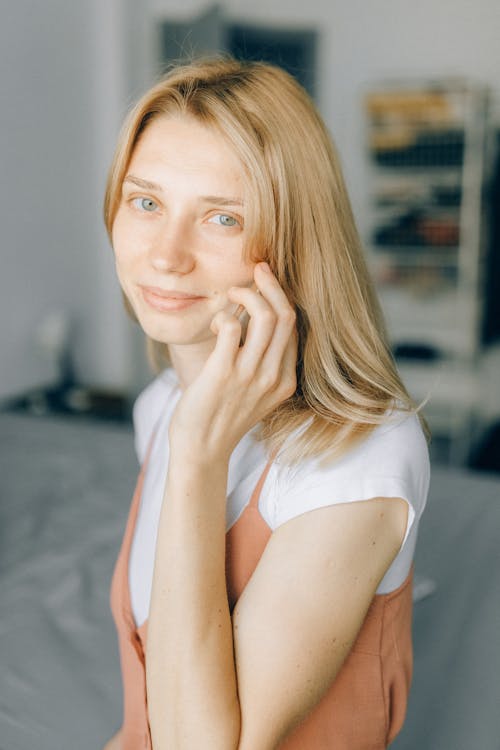 A Woman Smiling while Talking on the Phone