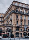 Facade of hotel in old building with ornamental walls