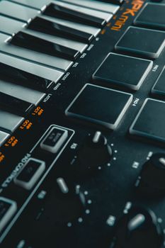 Detailed view of electronic keyboard keys and control buttons, perfect for music production themes.