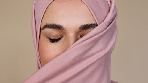 Free Woman Covering her Face with Pink Hijab Stock Photo