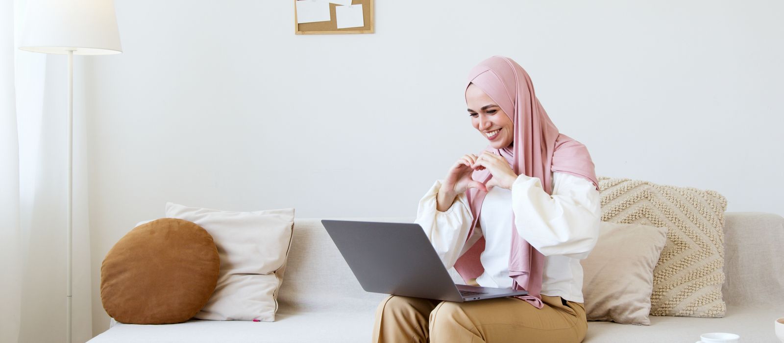 A woman on a video call at a laptop