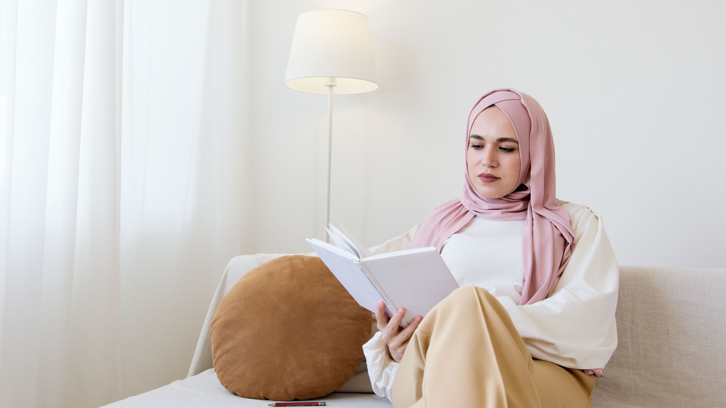 Woman in Yellow Hijab Reading a Book · Free Stock Photo