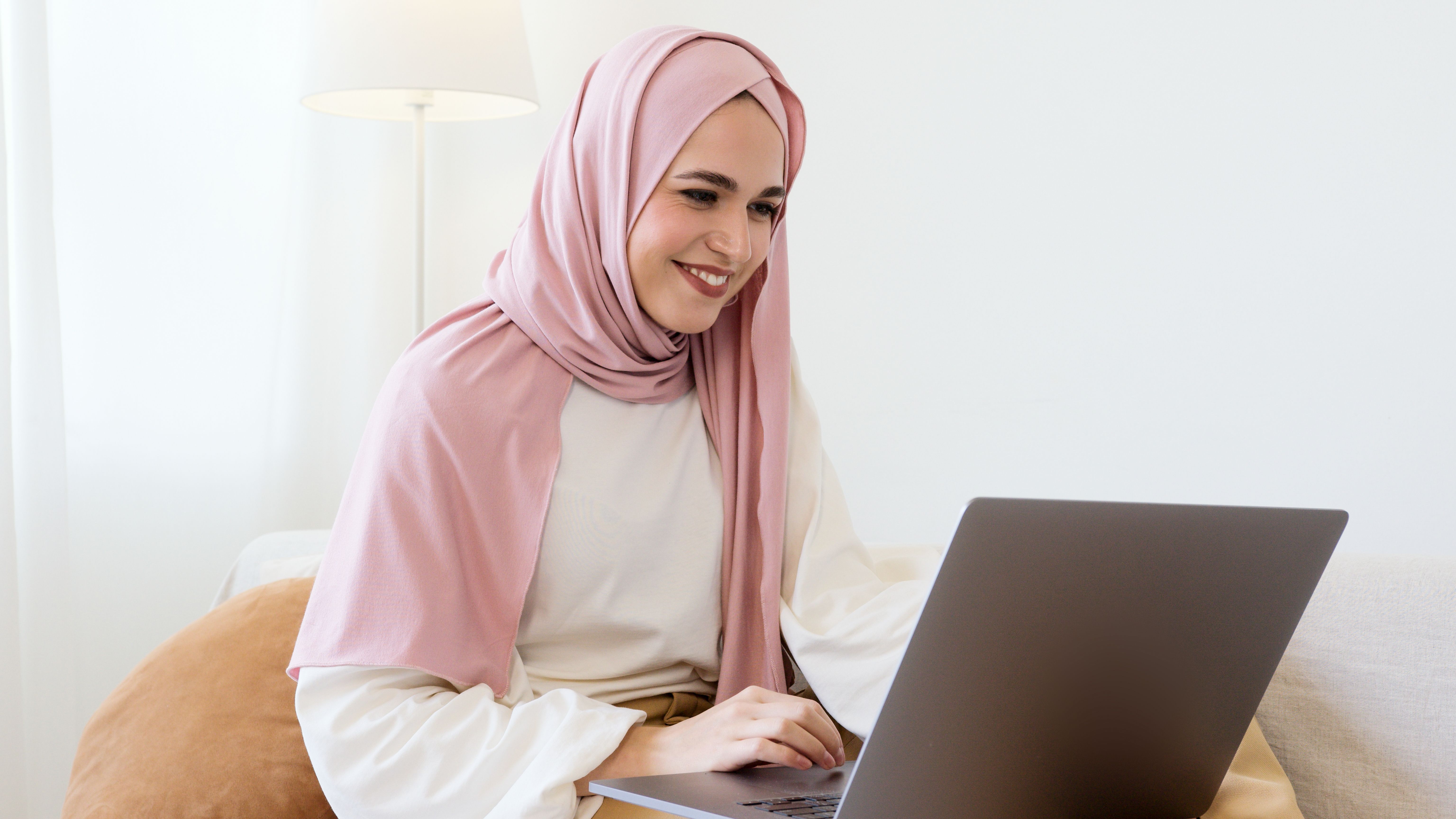 Woman in White Hijab Holding Pen Writing on White Paper · Free Stock Photo